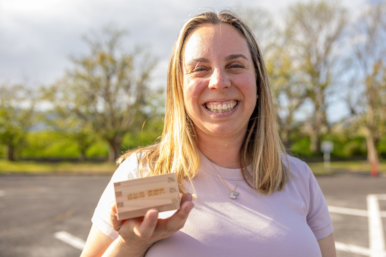 Guest smiling with her personalised masu gift