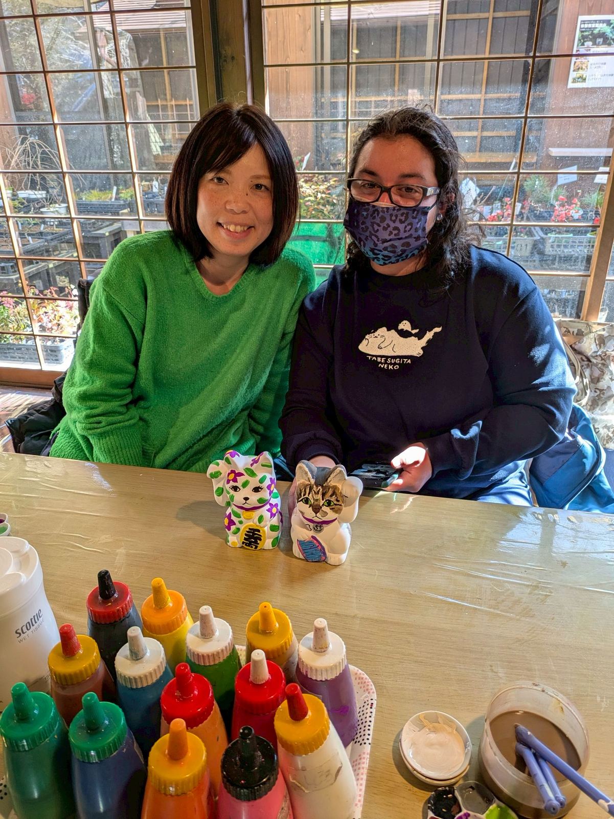 Misae and guest posing with their finished maneki-neko cats