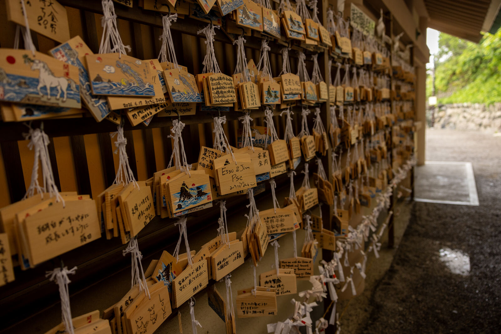 Rows of wooden ema votive tablets hung at the shrine