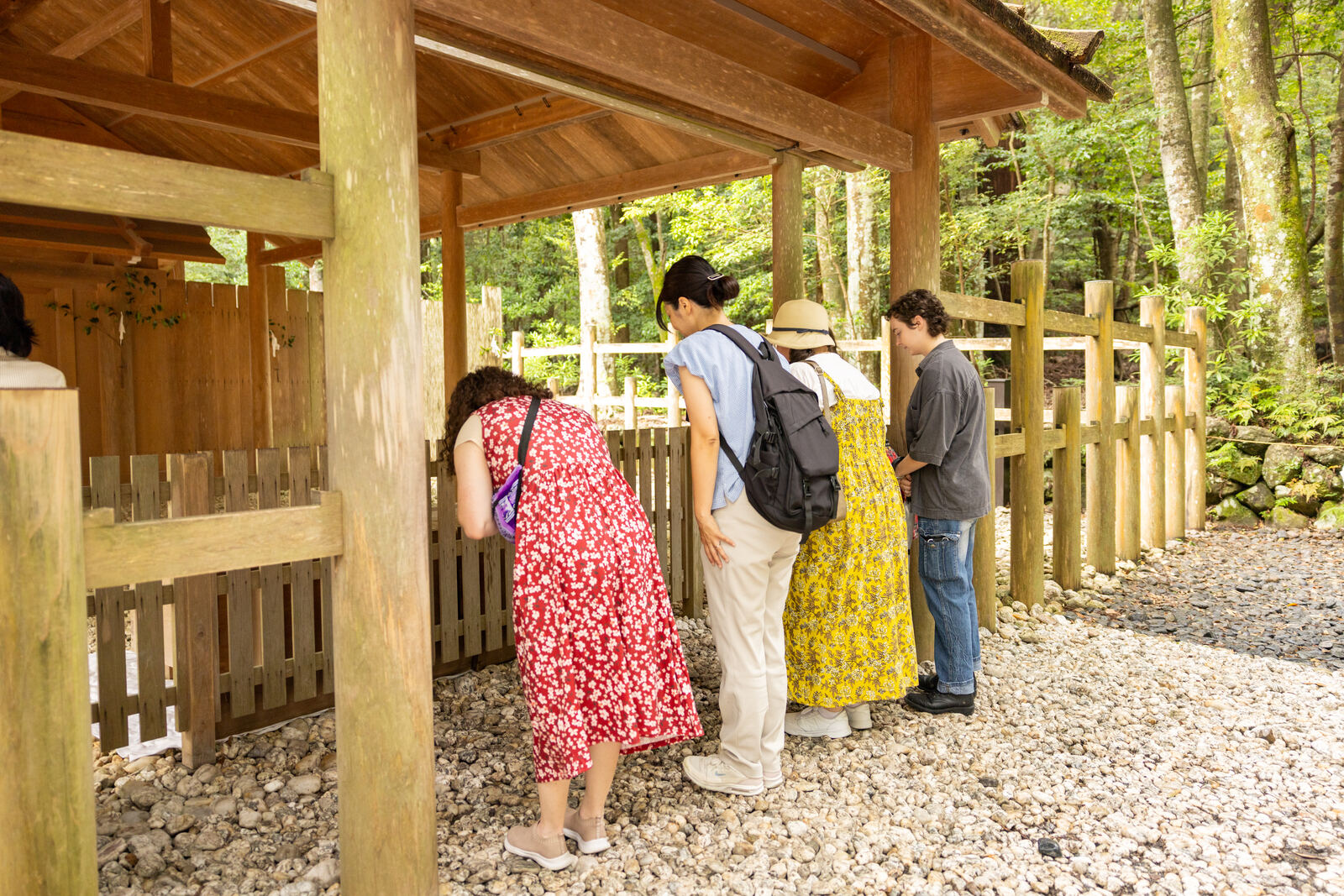 Guests bowing at the purification fountain near the Isuzu River