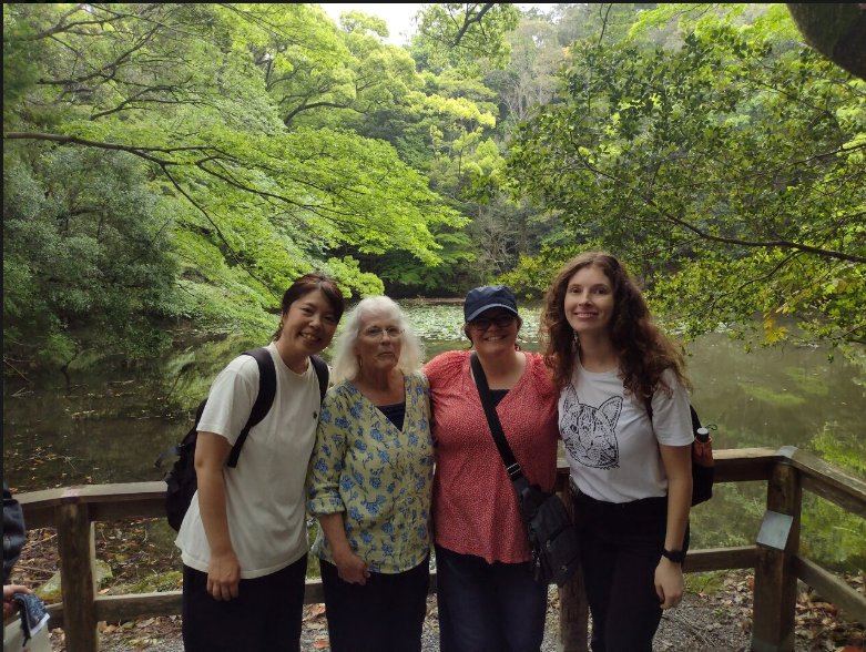 Misae and guests in the lush forest near the shrine