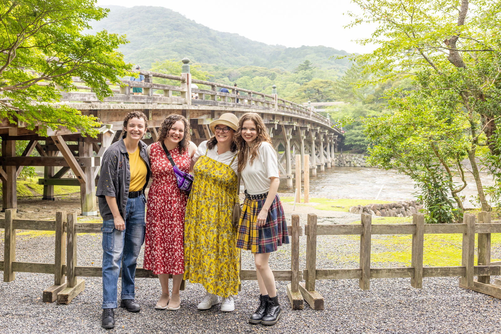Guests posing together on Uji-bashi bridge