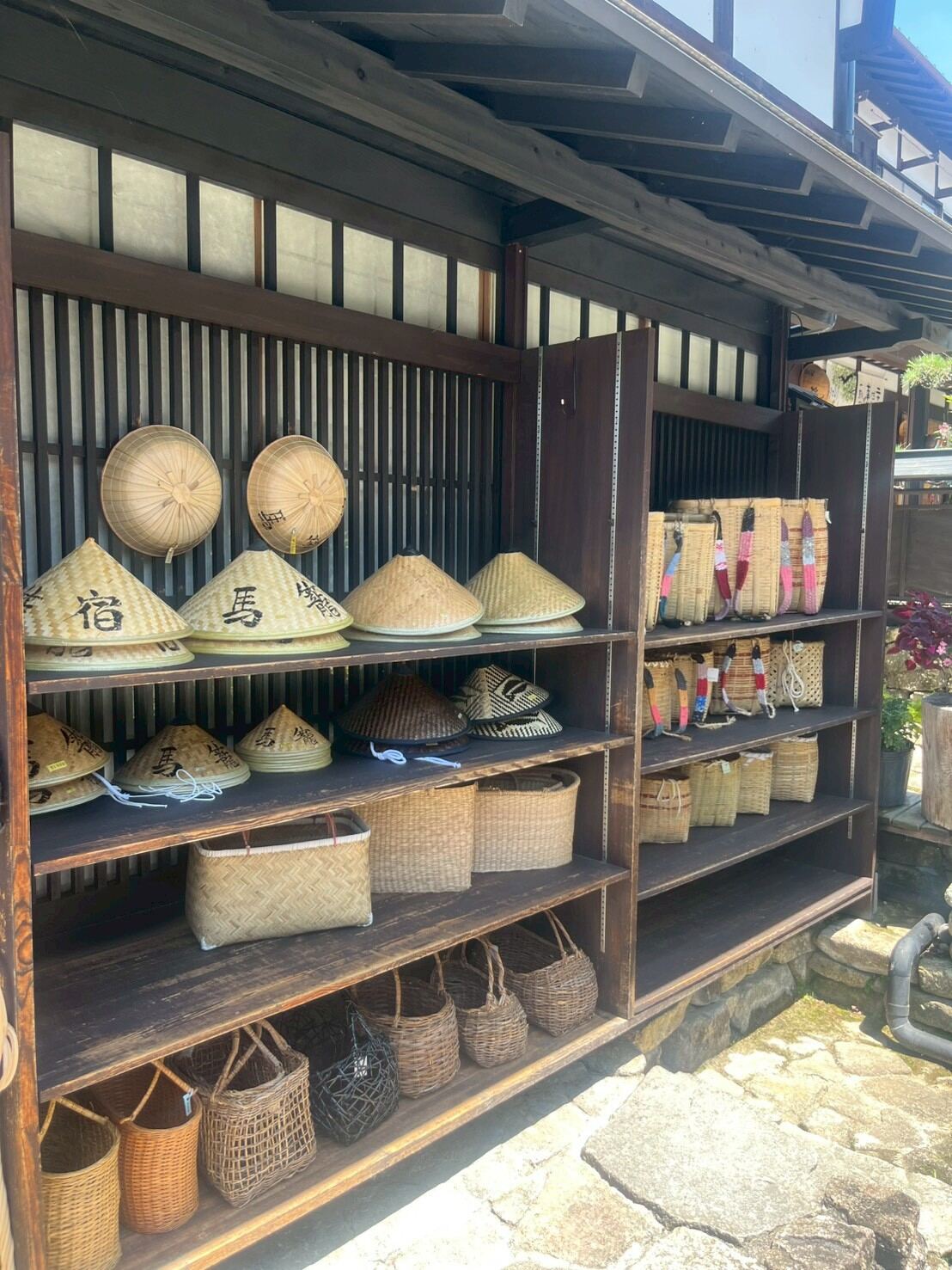 Straw hats and woven baskets for sale in Magome
