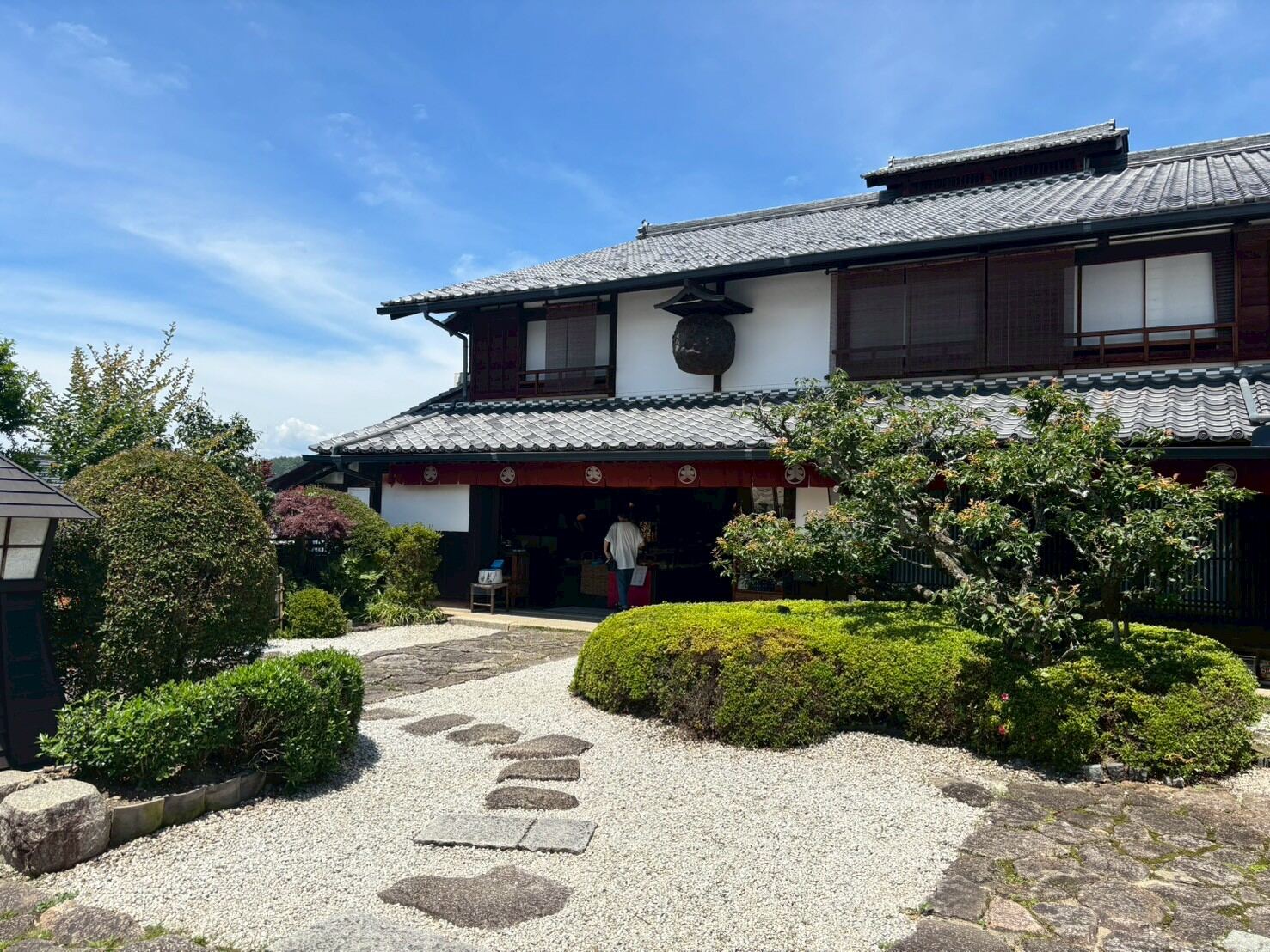A traditional shop building with a garden in Magome