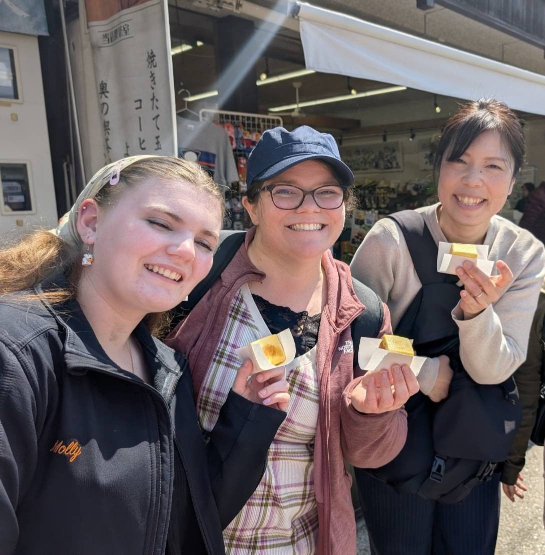 Guests enjoying mitarashi dango in Takayama